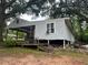 Backyard with elevated home and wood steps at 2588 Sandtown Sw Rd, Marietta, GA 30060