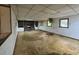Spacious basement with fireplace and shelving on walls needing repair at 2588 Sandtown Sw Rd, Marietta, GA 30060