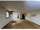 Basement view into other rooms needing repair, with holes in ceiling and floor at 2588 Sandtown Sw Rd, Marietta, GA 30060