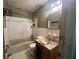 Bathroom view featuring a tub with white tiling and a vanity at 2588 Sandtown Sw Rd, Marietta, GA 30060