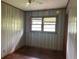 Bedroom features wood panel walls and a window at 2588 Sandtown Sw Rd, Marietta, GA 30060