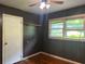 Bedroom with hardwood floor, ceiling fan, and a window at 2588 Sandtown Sw Rd, Marietta, GA 30060