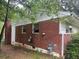 Back view of a brick home with visible windows and connections at 2588 Sandtown Sw Rd, Marietta, GA 30060