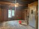 Unfinished garage features a window bringing in natural light, ceiling fan, and an unfinished walls at 2588 Sandtown Sw Rd, Marietta, GA 30060