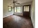 Cozy living room featuring a sunny bay window and hardwood floors at 2588 Sandtown Sw Rd, Marietta, GA 30060