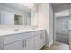Bright bathroom with a double vanity, white cabinets, and modern fixtures at 3005 Nicholas Dr, Villa Rica, GA 30180