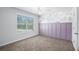 Bedroom featuring modern trim, large window, and a ceiling fan at 3005 Nicholas Dr, Villa Rica, GA 30180