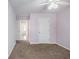 Bedroom with plush carpet, ceiling fan, and neutral paint at 3005 Nicholas Dr, Villa Rica, GA 30180