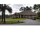 Elegant clubhouse featuring a covered entrance, well-manicured landscaping and a convenient parking area with golf carts at 3005 Nicholas Dr, Villa Rica, GA 30180