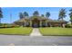 Stately clubhouse featuring classic architectural design with grand entrance, lush green lawn, and ample parking at 3005 Nicholas Dr, Villa Rica, GA 30180