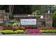 Elegant community sign for Mirror Lake Golf & Country Club, set amidst colorful flowers and manicured landscaping at 3005 Nicholas Dr, Villa Rica, GA 30180