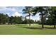 Lush green golf course view with mature trees and sand traps, perfect for outdoor enthusiasts at 3005 Nicholas Dr, Villa Rica, GA 30180