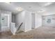 Upstairs hallway featuring neutral carpet and bright lighting at 3005 Nicholas Dr, Villa Rica, GA 30180