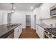 Modern kitchen with stainless appliances, granite counters, white cabinets, and a walk-in pantry at 3005 Nicholas Dr, Villa Rica, GA 30180