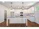 Modern kitchen with white cabinets, granite countertops, stainless steel appliances, and a center island at 3005 Nicholas Dr, Villa Rica, GA 30180