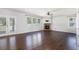 Spacious living room featuring hardwood floors, a stone fireplace, and access to the backyard at 3005 Nicholas Dr, Villa Rica, GA 30180