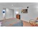 Bright bedroom with light hardwood flooring, modern furnishings, and a TV for a relaxing atmosphere at 301 Cobblestone Trl, Avondale Estates, GA 30002