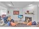 Bright living room with a cozy fireplace and comfortable seating area at 301 Cobblestone Trl, Avondale Estates, GA 30002