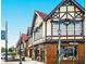 Charming shops with Tudor architecture, garland holiday decor, and street-side appeal in a quaint business district at 301 Cobblestone Trl, Avondale Estates, GA 30002