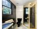 The bathroom includes a unique vanity, black toilet, and sleek glass shower stall at 3272 Pinestream Nw Rd, Atlanta, GA 30327