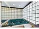 Bathroom features a luxurious blue jacuzzi tub with glass block surround, offering privacy and natural light at 3272 Pinestream Nw Rd, Atlanta, GA 30327