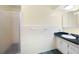 Bathroom featuring a glass shower, a vanity with a dark countertop and white cabinets at 3272 Pinestream Nw Rd, Atlanta, GA 30327