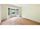 Bright bedroom with a bay window overlooking the lush green yard and beautiful hardwood floors at 3272 Pinestream Nw Rd, Atlanta, GA 30327