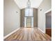 Spacious foyer with high ceilings, wood floors, and a decorative chandelier at 3272 Pinestream Nw Rd, Atlanta, GA 30327