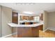 Eat-in kitchen featuring a breakfast bar, and a bright window at 3272 Pinestream Nw Rd, Atlanta, GA 30327