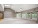 Spacious living room with high ceilings, skylights, and glass doors to the deck at 3272 Pinestream Nw Rd, Atlanta, GA 30327