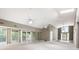 Open-concept living room with high ceilings, skylights, and access to the foyer at 3272 Pinestream Nw Rd, Atlanta, GA 30327