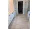 Bathroom featuring tile floors, double sink vanity, and glass enclosed shower at 365 Rodeo Dr, Auburn, GA 30011