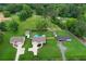 Aerial view showcasing the home, its backyard, and the surrounding neighborhood at 521 Peeples Valley Nw Rd, Cartersville, GA 30121