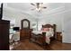 Comfortable bedroom featuring hardwood floors, ceiling fan, and lots of natural light at 521 Peeples Valley Nw Rd, Cartersville, GA 30121
