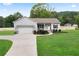 The exterior of the home featuring a well-kept lawn and inviting curb appeal at 521 Peeples Valley Nw Rd, Cartersville, GA 30121