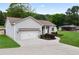 Exterior view of home with a long driveway and attached garage at 521 Peeples Valley Nw Rd, Cartersville, GA 30121