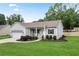Charming home with a well-manicured lawn, gray siding, and a cozy front porch at 521 Peeples Valley Nw Rd, Cartersville, GA 30121