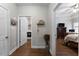 Hallway leading to bedroom and laundry room, boasting beautiful hardwood floors at 521 Peeples Valley Nw Rd, Cartersville, GA 30121