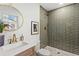 Bathroom featuring modern fixtures, vanity with sink, and tiled shower at 1239 Teakwood Trl, Stone Mountain, GA 30083
