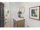 Cozy bathroom featuring a modern vanity, gold round mirror, and stylish decor at 1239 Teakwood Trl, Stone Mountain, GA 30083