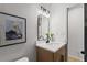 Bathroom featuring a modern vanity, rectangular mirror, and stylish decor at 1239 Teakwood Trl, Stone Mountain, GA 30083