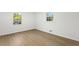 Bedroom features hardwood floors, a window with green views, and white walls at 1239 Teakwood Trl, Stone Mountain, GA 30083