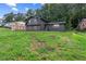 Charming home featuring a brick facade, lovely landscaping, and a well-maintained lawn at 1239 Teakwood Trl, Stone Mountain, GA 30083