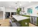 Bright modern kitchen with white counters, island seating and stainless steel appliances at 1239 Teakwood Trl, Stone Mountain, GA 30083