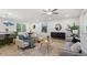 Open-concept living space with modern décor, hardwood floors and large windows at 1239 Teakwood Trl, Stone Mountain, GA 30083