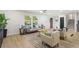 Inviting living space featuring lots of seating, with stairs, light floors and modern finishes at 1239 Teakwood Trl, Stone Mountain, GA 30083