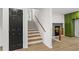 Stairway connecting the different levels of the home next to the entry door and green cabinets at 1239 Teakwood Trl, Stone Mountain, GA 30083