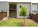 Backyard featuring wooden fence, green grass, patio, and deck at 203 Holden Way, Woodstock, GA 30189