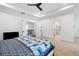 Spacious bedroom with modern ceiling fan and ensuite bathroom at 203 Holden Way, Woodstock, GA 30189