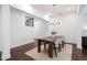 Bright dining area with hardwood floors and modern light fixture, perfect for entertaining at 203 Holden Way, Woodstock, GA 30189